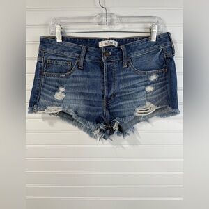 Hollister women’s Y2K low rise cut off‎ shorty denim button fly short. Size 7/28